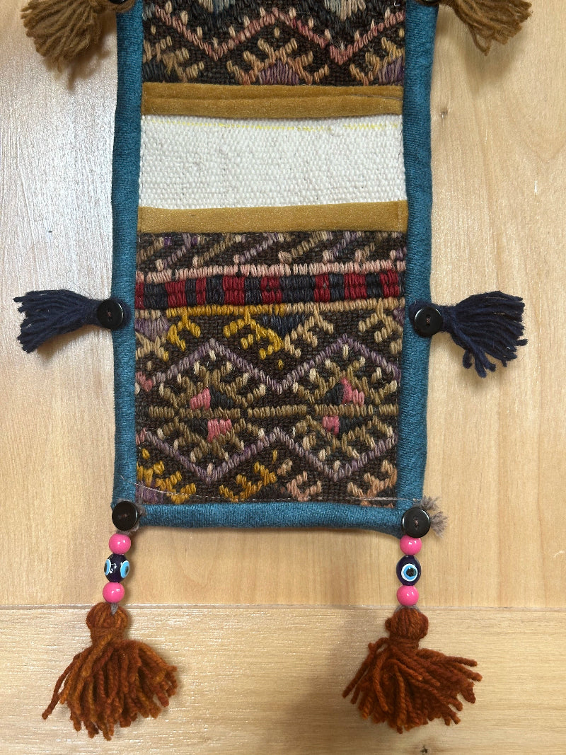 mustard, charcoal and teal colored fabric 3 pocket wall organizer and accessory made from turkish rug fragments