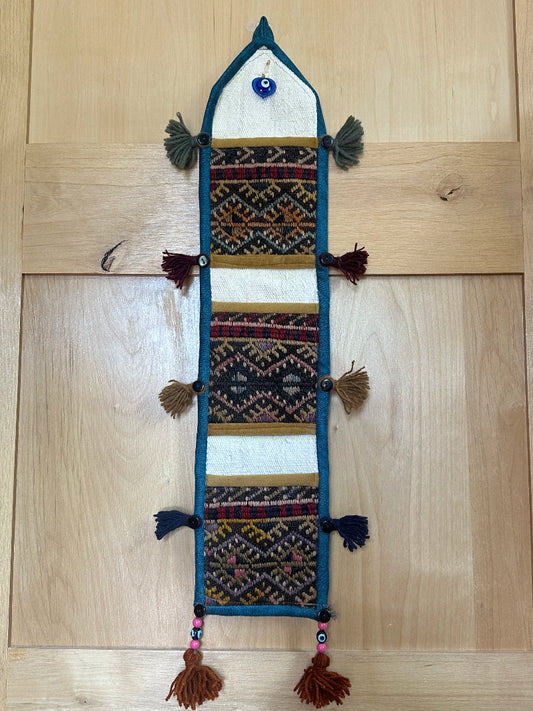 mustard, charcoal and teal colored fabric 3 pocket wall organizer and accessory made from turkish rug fragments