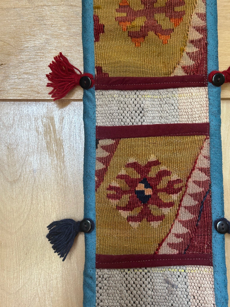 olive green, maroon and teal colored fabric 3 pocket wall organizer and accessory made from turkish rug fragments