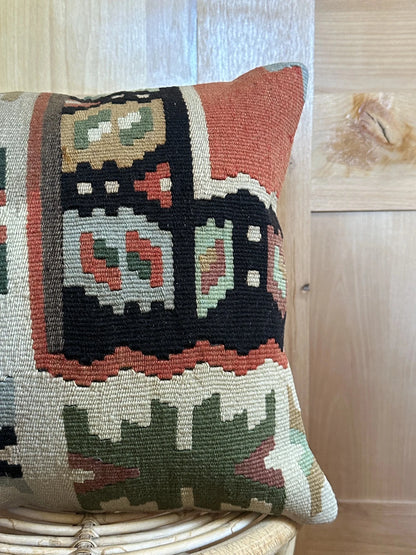 16 by 16 geometric turkish throw pillow featuring pops of dark green, rust and robins egg blue