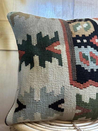 16 by 16 geometric turkish throw pillow featuring pops of dark green, rust and robins egg blue