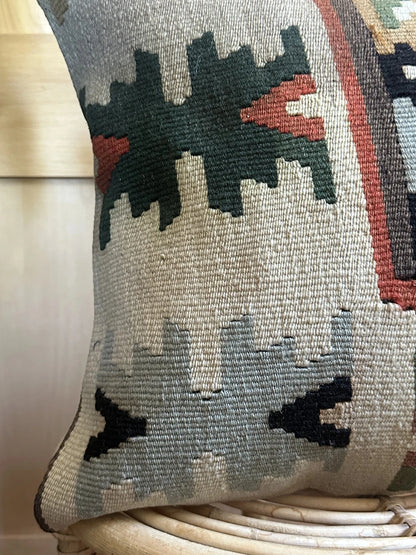 16 by 16 geometric turkish throw pillow featuring pops of dark green, rust and robins egg blue