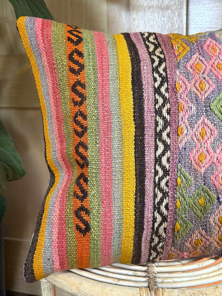 Handwoven multi-colored Turkish throw pillow, 16x16 inches, wool front with geometric design and pops of yellow and orange, cotton backing—boho home decor.