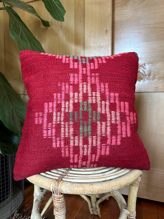 Handwoven red and pink Turkish throw pillow, 16x16 inches, wool front with geometric design, cotton backing—boho home decor.