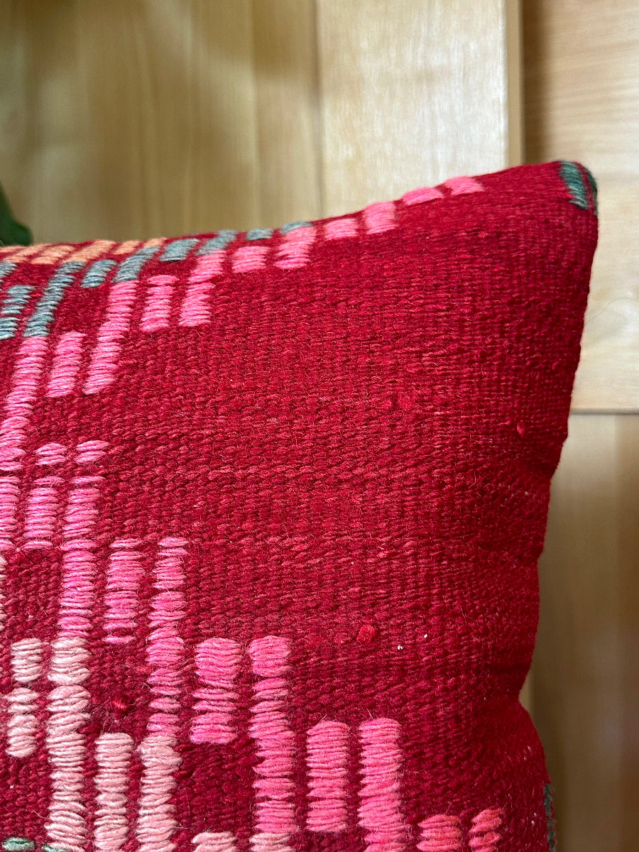 Handwoven red and pink Turkish throw pillow, 16x16 inches, wool front with geometric design, cotton backing—boho home decor.