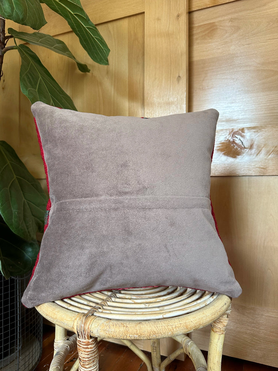 Handwoven red and pink Turkish throw pillow, 16x16 inches, wool front with geometric design, cotton backing—boho home decor.