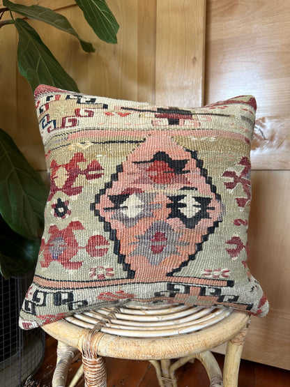 Handwoven vintage Turkish throw pillow, 16x16 inches, wool front with geometric design and pops of navy and maroon, cotton backing—boho home decor.