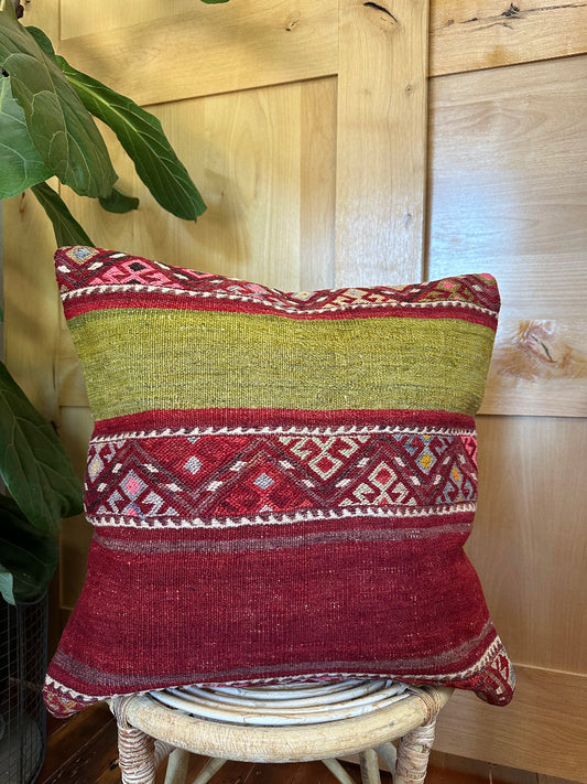 Handwoven red and green Turkish throw pillow, 20x20 inches, wool front with striped design and pops of white and pink, cotton backing—boho home decor.