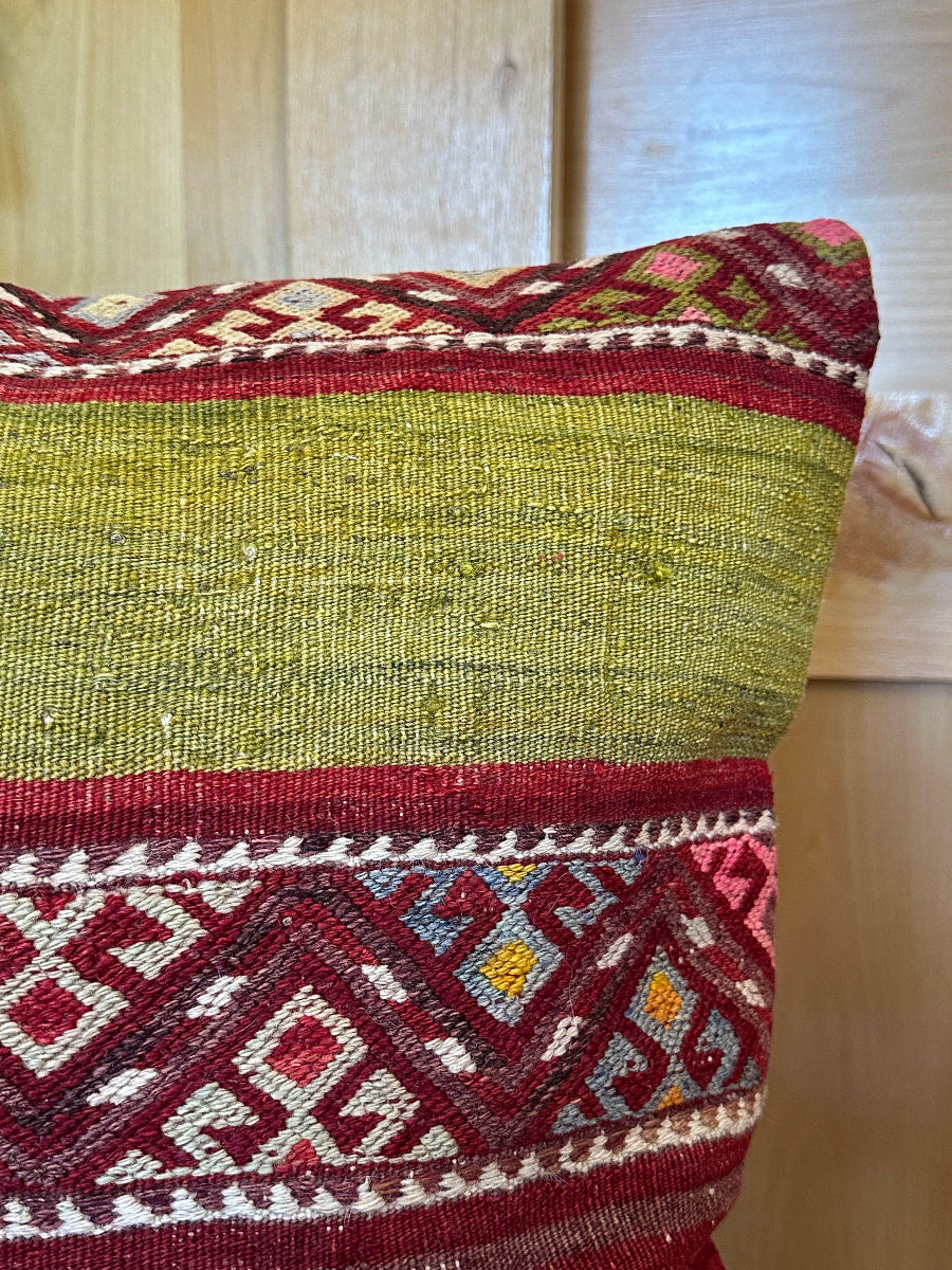 Handwoven red and green Turkish throw pillow, 20x20 inches, wool front with striped design and pops of white and pink, cotton backing—boho home decor.