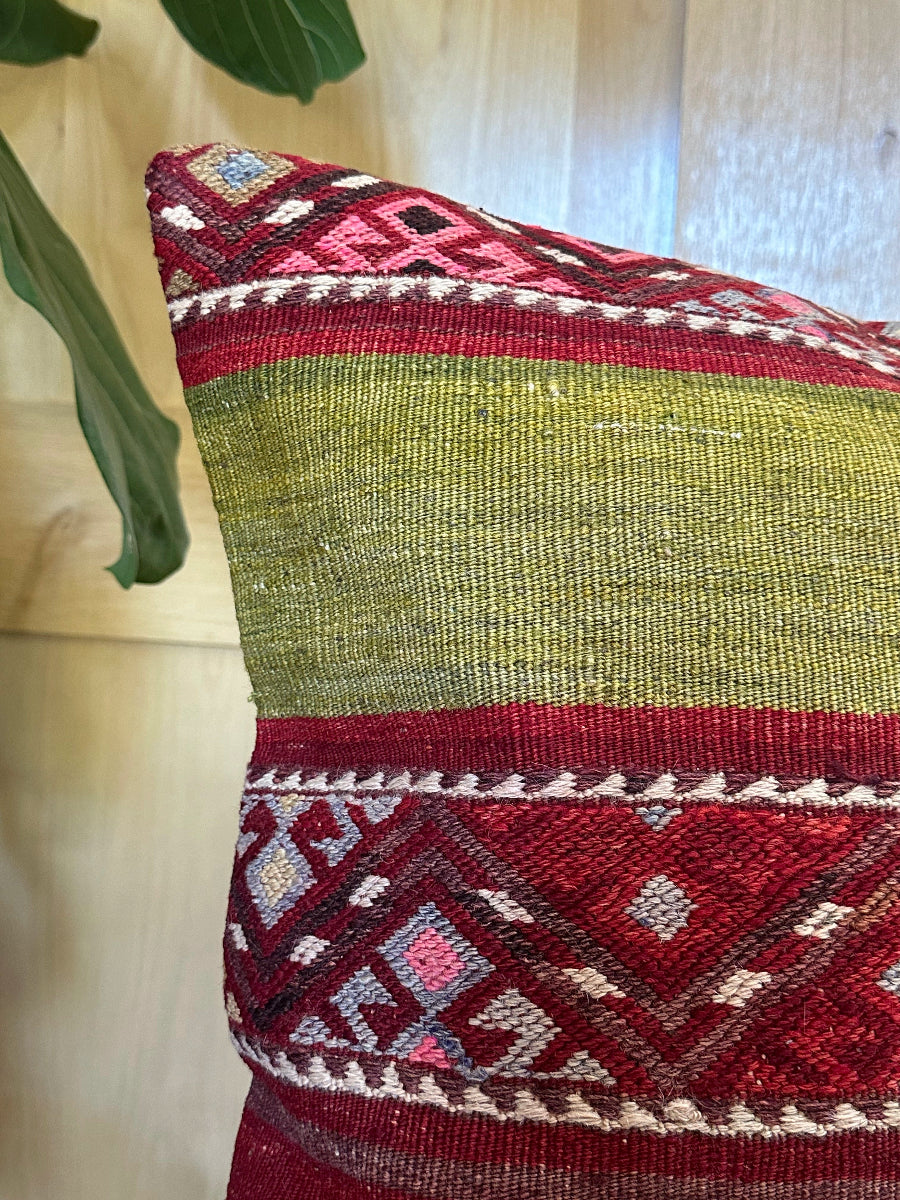 Handwoven red and green Turkish throw pillow, 20x20 inches, wool front with striped design and pops of white and pink, cotton backing—boho home decor.