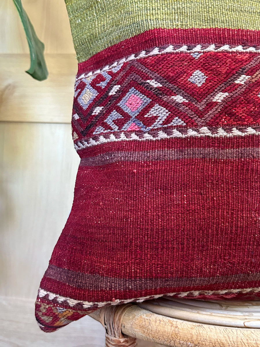 Handwoven red and green Turkish throw pillow, 20x20 inches, wool front with striped design and pops of white and pink, cotton backing—boho home decor.