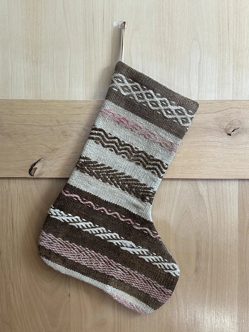 brown and tan striped handmade Turkish Christmas stocking with pink woven stripes throughout