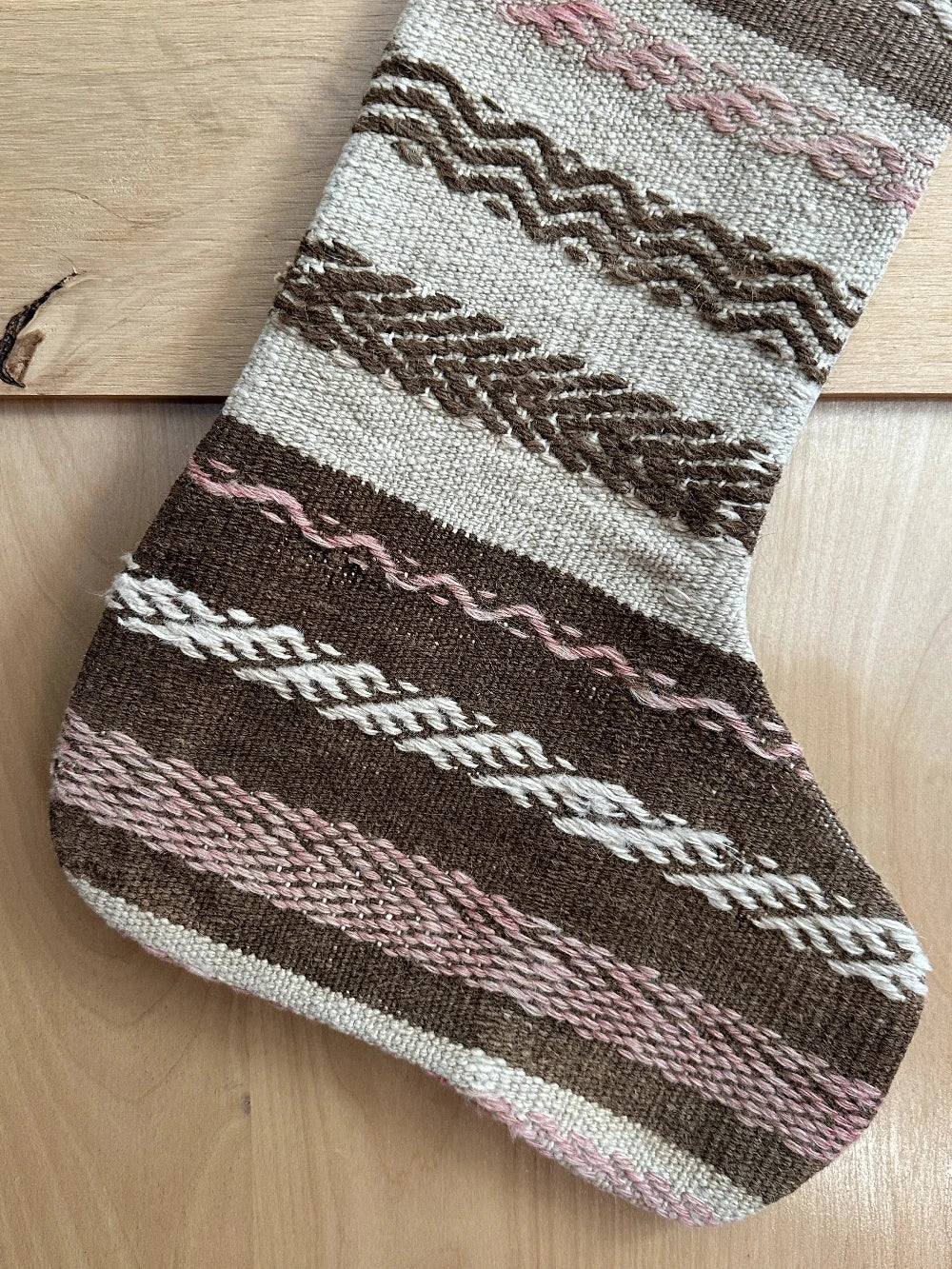 brown and tan striped handmade Turkish Christmas stocking with pink woven stripes throughout