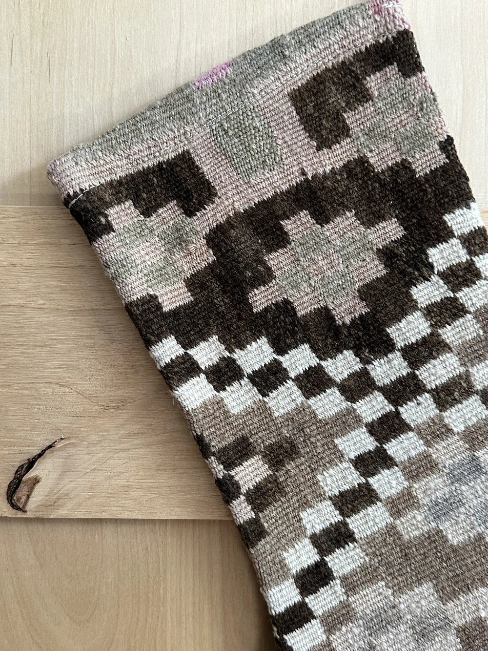 brown and cream handmade Turkish Christmas stocking featuring checkered lines and other geometric shapes