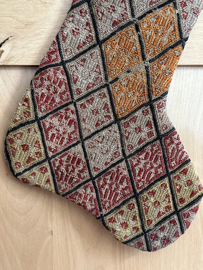 colorful handmade Turkish Christmas stocking featuring a checkered quilted pattern