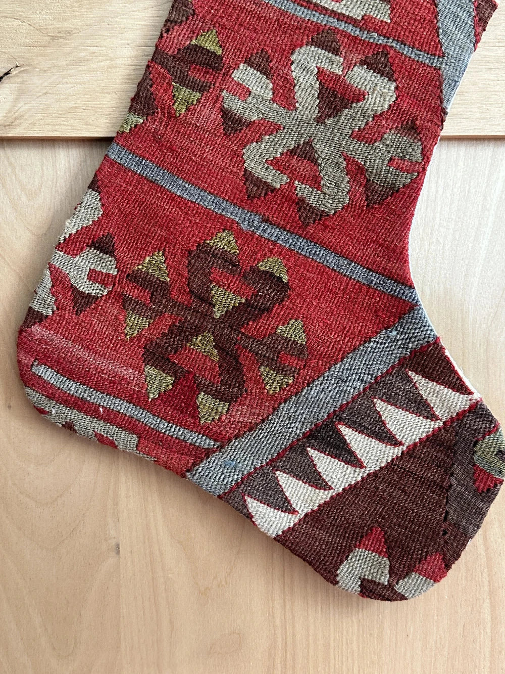 handmade turkish christmas stocking featuring a red body with accents of green, light blue, maroon and white