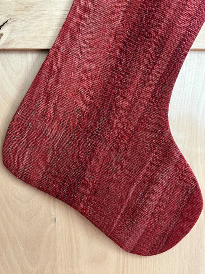 Solid red handmade turkish Christmas stocking featuring a deep fire engine red hue