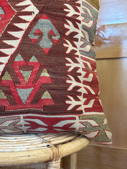 Handwoven red and brown geometric Turkish throw pillow, 20x20 inches, wool front with pops of white and green, cotton backing—boho home decor.