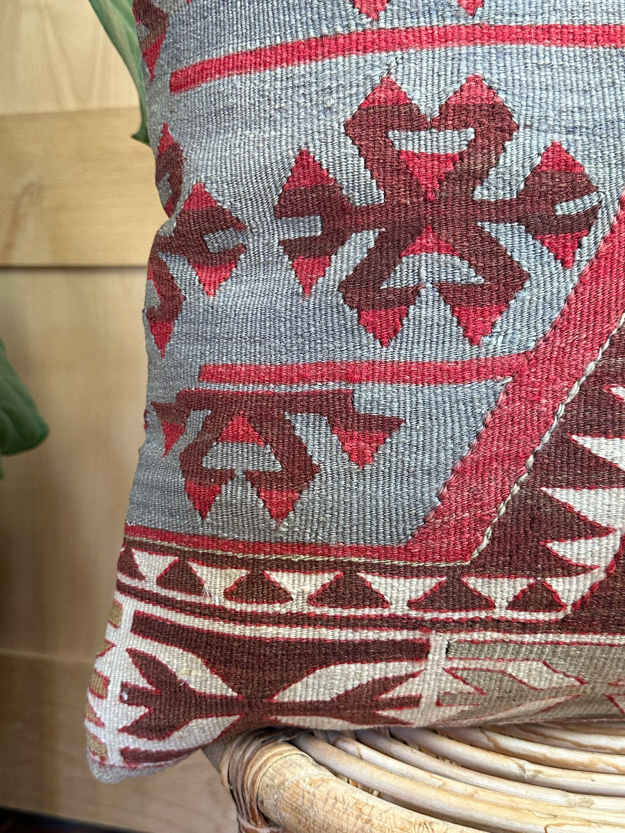 Handwoven red and brown geometric Turkish throw pillow, 20x20 inches, wool front with pops of white and green, cotton backing—boho home decor.