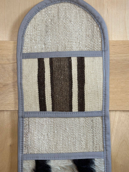 Decorative, handmade Turkish rug wall organizer with neutral stripe designs and 3 storage pockets. Upcycled vintage textile art by High Pile Designs.