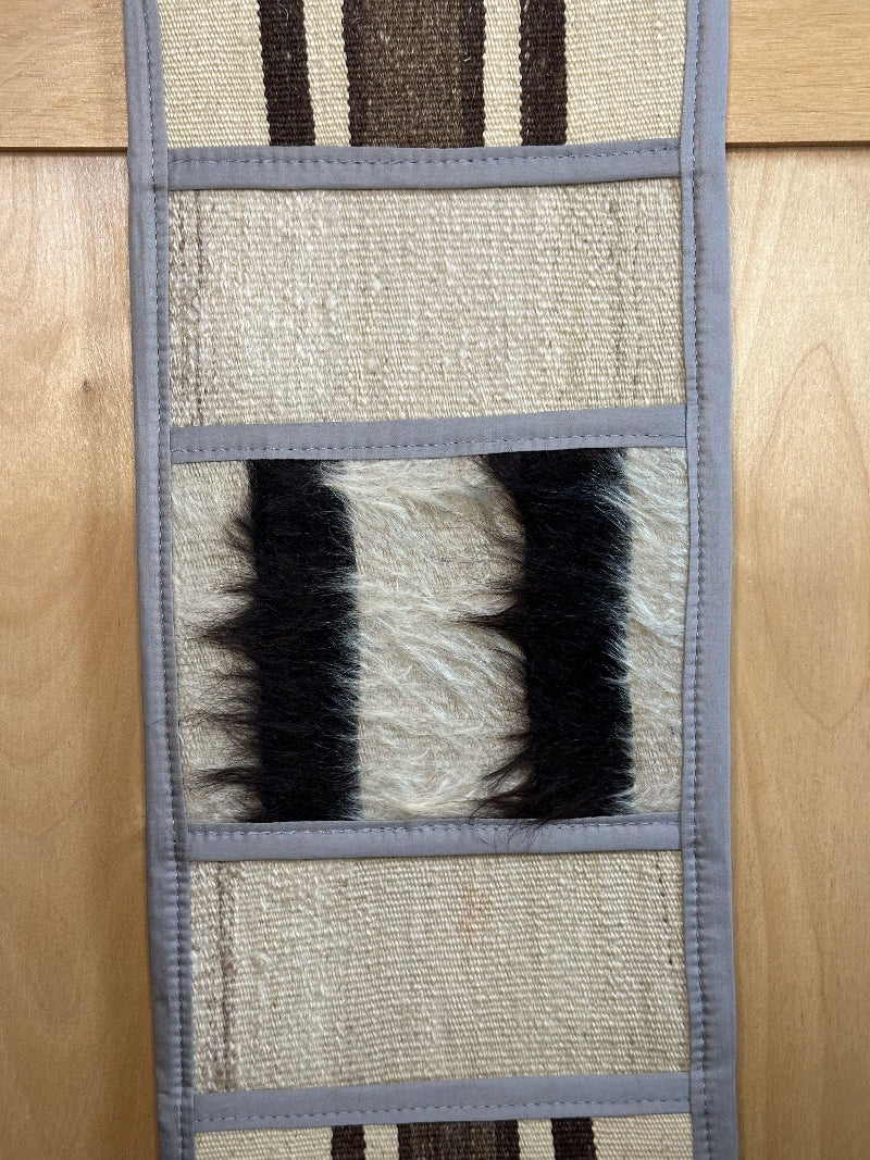 Decorative, handmade Turkish rug wall organizer with neutral stripe designs and 3 storage pockets. Upcycled vintage textile art by High Pile Designs.