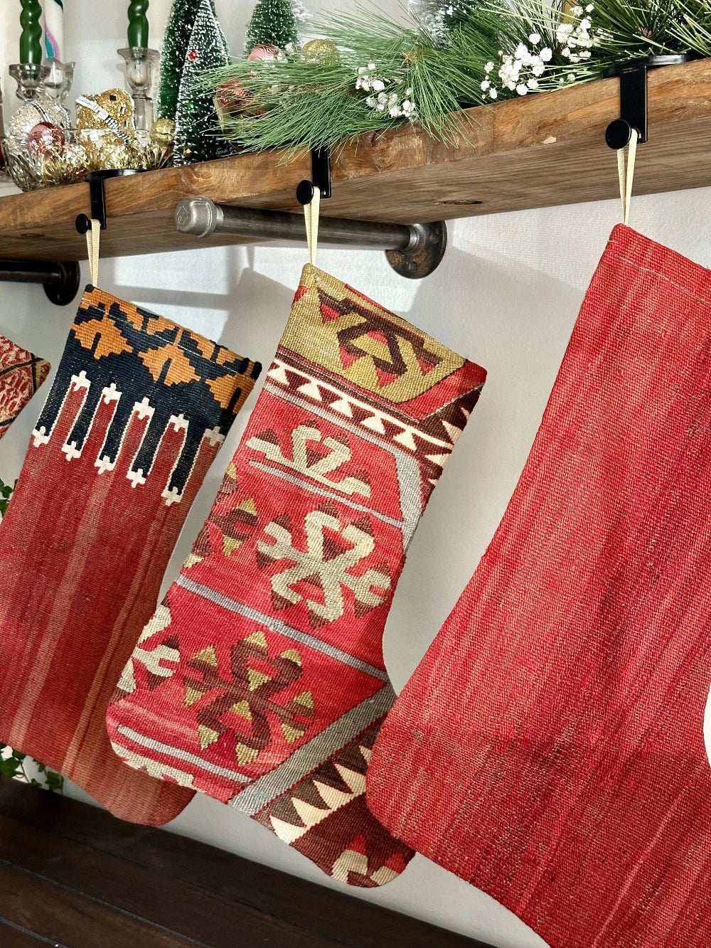 handmade Turkish christmas stockings featuring different geometric patterns and differnet hues of red