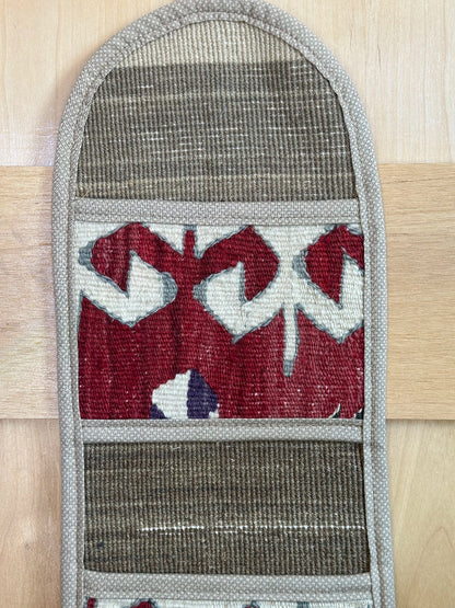 Decorative, handmade Turkish rug wall organizer with vibrant stripe designs and 3 storage pockets. Upcycled vintage textile art by High Pile Designs. 