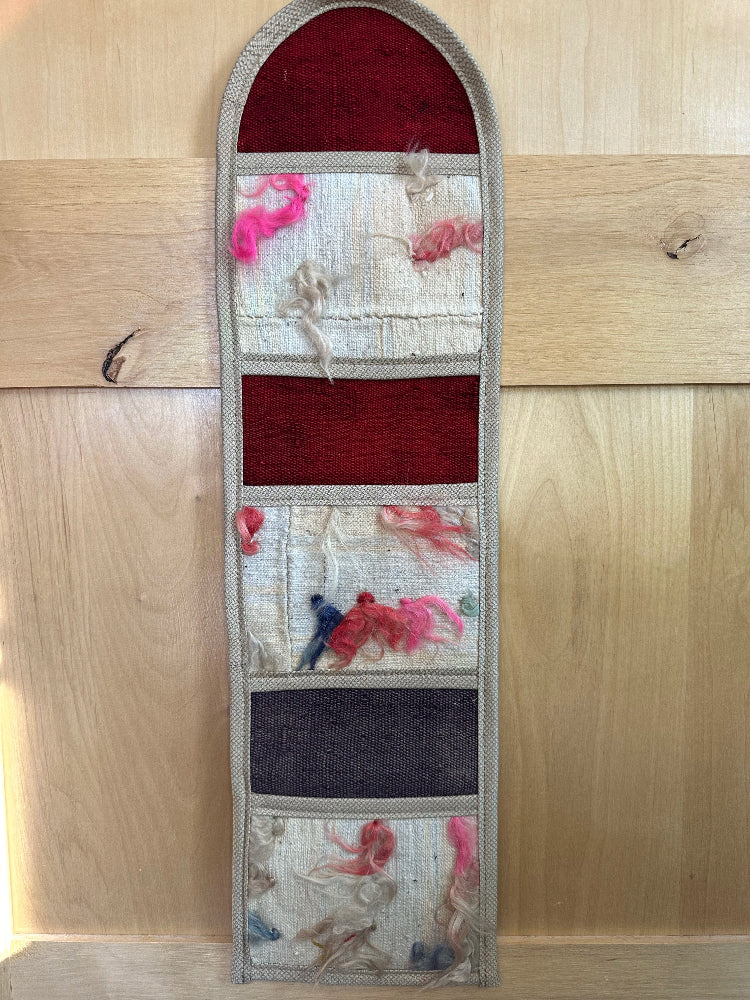 Decorative, handmade Turkish rug wall organizer with vibrant stripe designs and 3 storage pockets. Upcycled vintage textile art by High Pile Designs. 