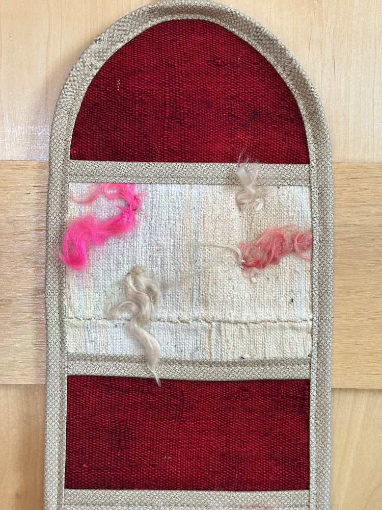 Decorative, handmade Turkish rug wall organizer with vibrant stripe designs and 3 storage pockets. Upcycled vintage textile art by High Pile Designs. 