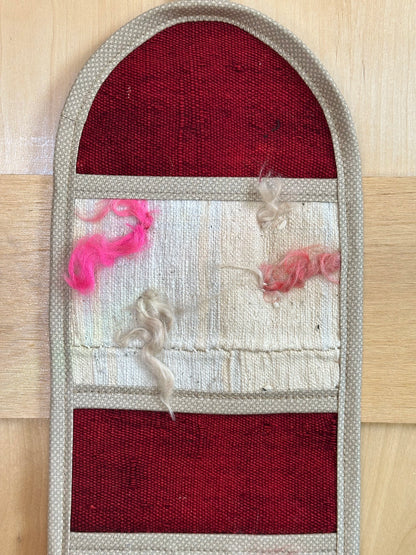 Decorative, handmade Turkish rug wall organizer with vibrant stripe designs and 3 storage pockets. Upcycled vintage textile art by High Pile Designs. 