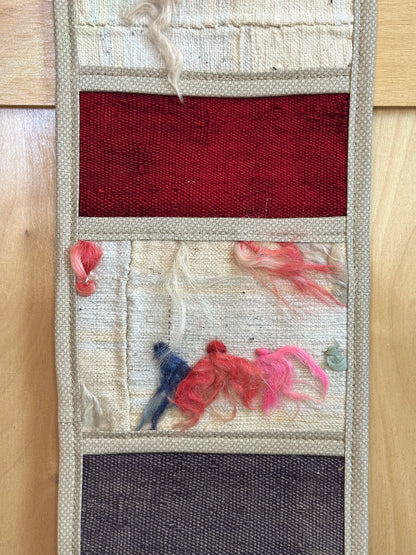 Decorative, handmade Turkish rug wall organizer with vibrant stripe designs and 3 storage pockets. Upcycled vintage textile art by High Pile Designs. 