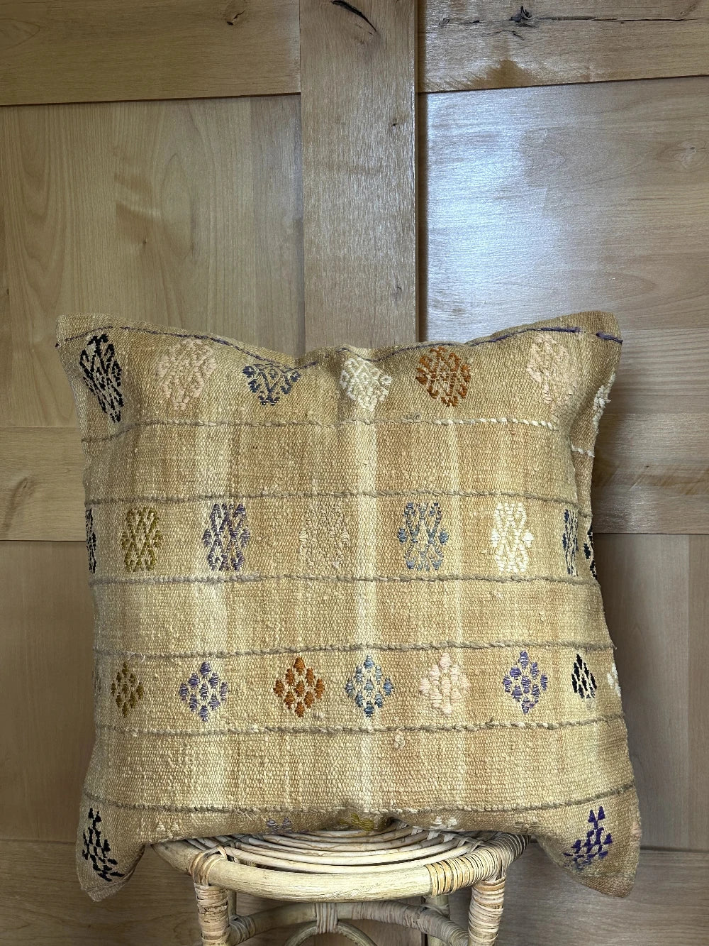 26 by 26 tan plaid turkish pillow that also doubles as a floor cushion with multi-colored floral embroidery