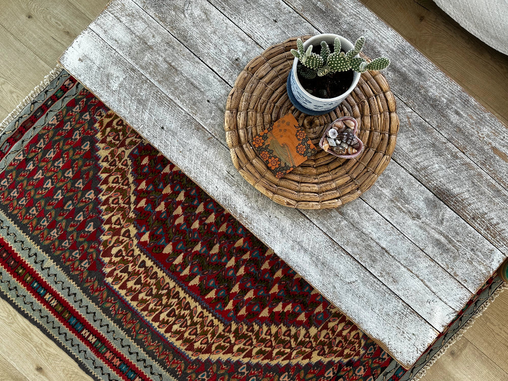 Handwoven Senneh Kilim rug, featuring intricate geometric patterns, a central medallion design, and rich earthy red, deep blue, and neutral tones. Flat-woven wool rug with fine detailing and a slit tapestry weave, perfect for bohemian, modern, or traditional home décor.