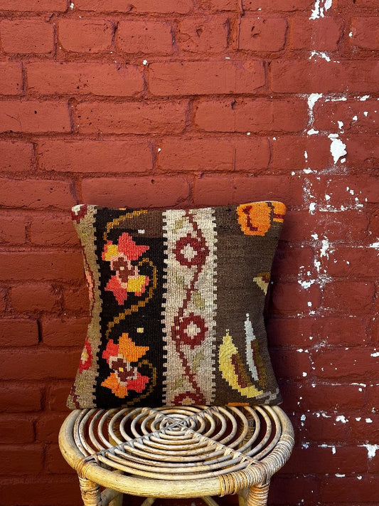 15 by 15 neutral Turkish throw pillow featuring muted tones and a beautiful floral pattern upcycled from an old Turkish rug