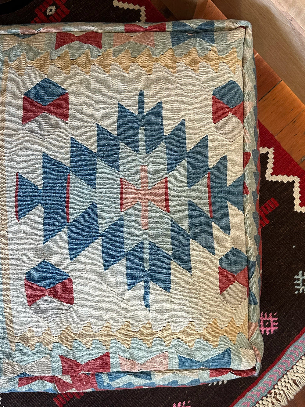 Handmade vintage Turkish rug pouf with blue & neutral tones, up-cycled from authentic wool Kilim rugs. Perfect as a unique bohemian floor cushion, ottoman, or accent seating for living rooms, bedrooms, or cozy spaces. Ethically crafted by artisans in Turkey.