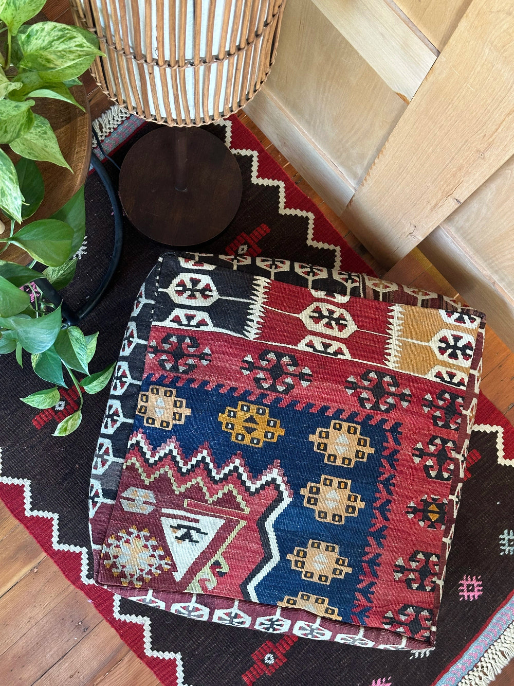 Handmade vintage Turkish rug pouf with geometric colorful tones, up-cycled from authentic wool Kilim rugs. Perfect as a unique bohemian floor cushion, ottoman, or accent seating for living rooms, bedrooms, or cozy spaces. Ethically crafted by artisans in Turkey.