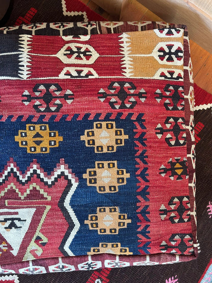 Handmade vintage Turkish rug pouf with geometric colorful tones, up-cycled from authentic wool Kilim rugs. Perfect as a unique bohemian floor cushion, ottoman, or accent seating for living rooms, bedrooms, or cozy spaces. Ethically crafted by artisans in Turkey.