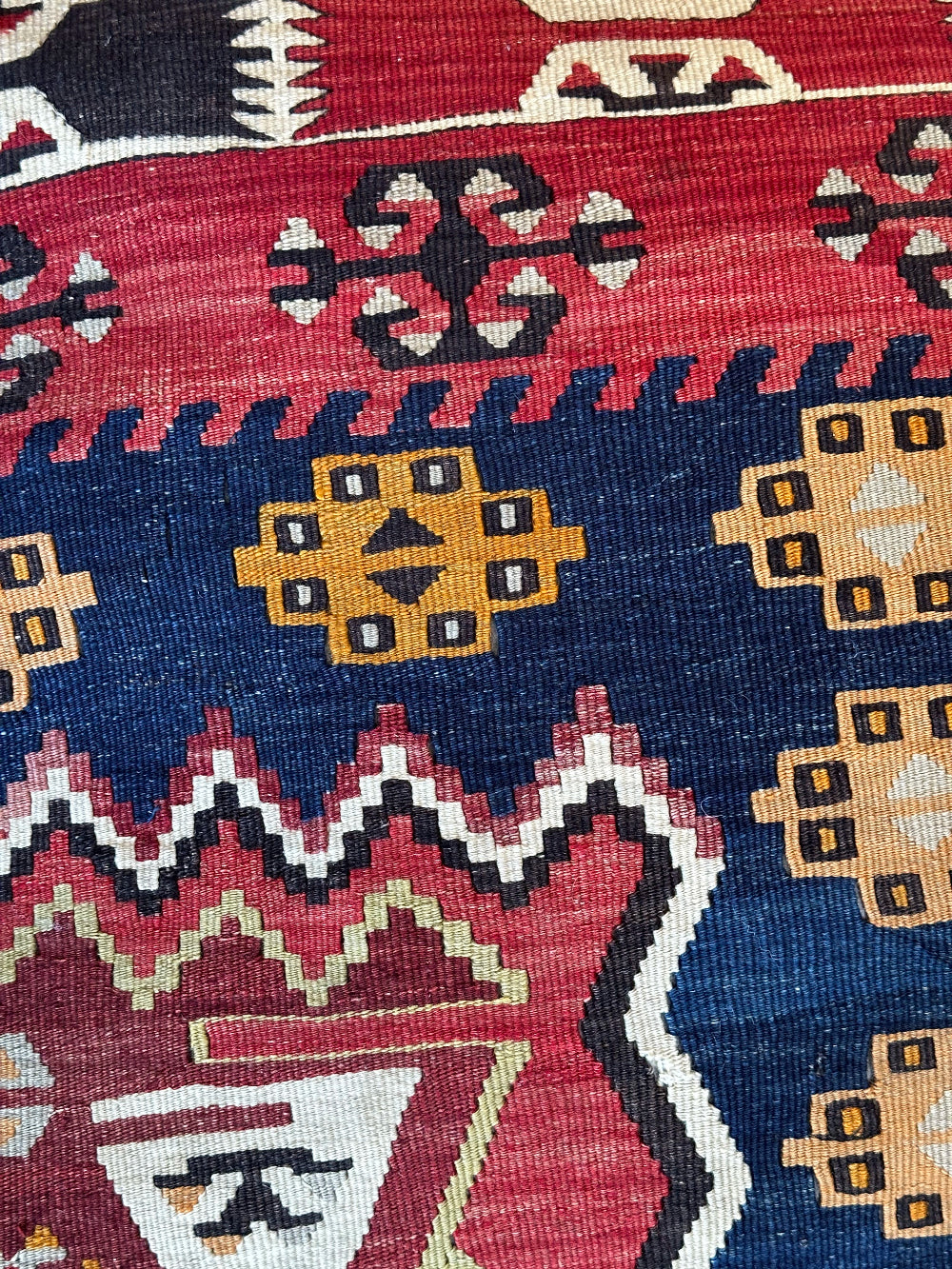 Handmade vintage Turkish rug pouf with geometric colorful tones, up-cycled from authentic wool Kilim rugs. Perfect as a unique bohemian floor cushion, ottoman, or accent seating for living rooms, bedrooms, or cozy spaces. Ethically crafted by artisans in Turkey.