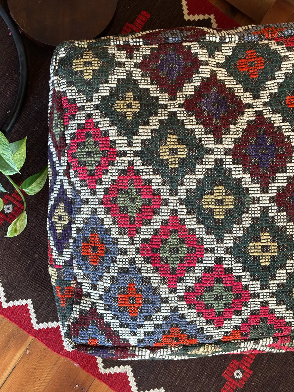 Handmade vintage Turkish rug pouf with colorful tones, up-cycled from authentic wool Kilim rugs. Perfect as a unique bohemian floor cushion, ottoman, or accent seating for living rooms, bedrooms, or cozy spaces. Ethically crafted by artisans in Turkey.