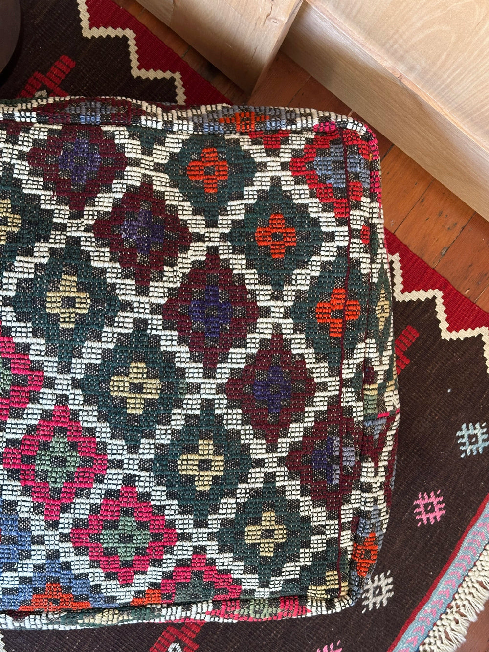 Handmade vintage Turkish rug pouf with colorful tones, up-cycled from authentic wool Kilim rugs. Perfect as a unique bohemian floor cushion, ottoman, or accent seating for living rooms, bedrooms, or cozy spaces. Ethically crafted by artisans in Turkey.