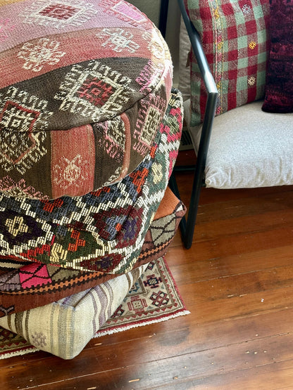 Handmade vintage Turkish rug pouf with neutral tones, up-cycled from authentic wool Kilim rugs. Perfect as a unique bohemian floor cushion, ottoman, or accent seating for living rooms, bedrooms, or cozy spaces. Ethically crafted by artisans in Turkey.