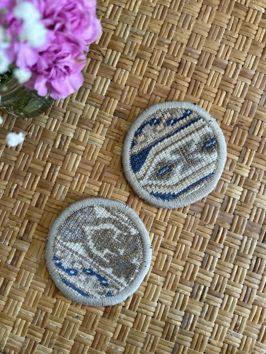 Handmade, unique 5 inch diameter turkish rug coaster set featuring navy and gold coloring and geometric pattern