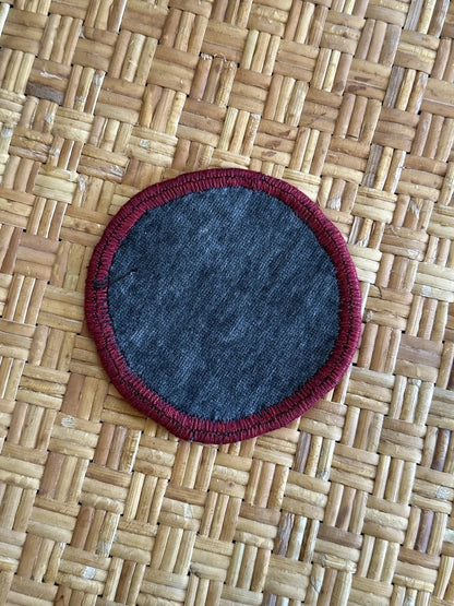 3.75 diameter Turkish coaster set made from Turkish rugs and pillow scraps featuring a colorful geometric design