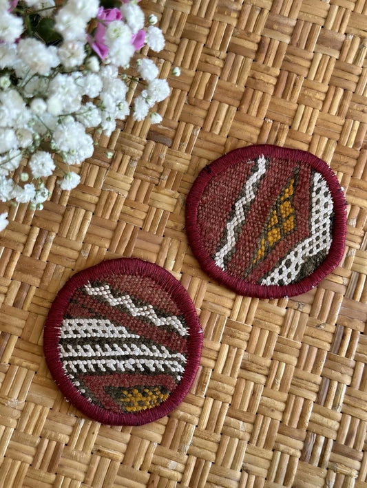 Turkish coaster set measuring 3.75 inches featuring a white and orange geometric print