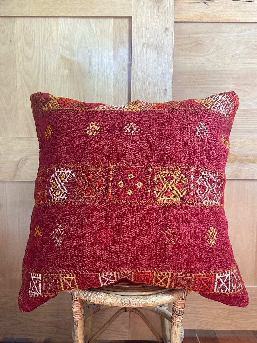 Handwoven red embroidered Turkish throw pillow, 26x26 inches, wool front with geometric design and pops of yellow and white, cotton backing—boho home decor.