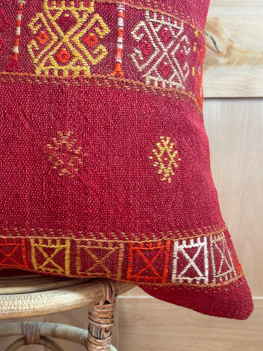 Handwoven red embroidered Turkish throw pillow, 26x26 inches, wool front with geometric design and pops of yellow and white, cotton backing—boho home decor.