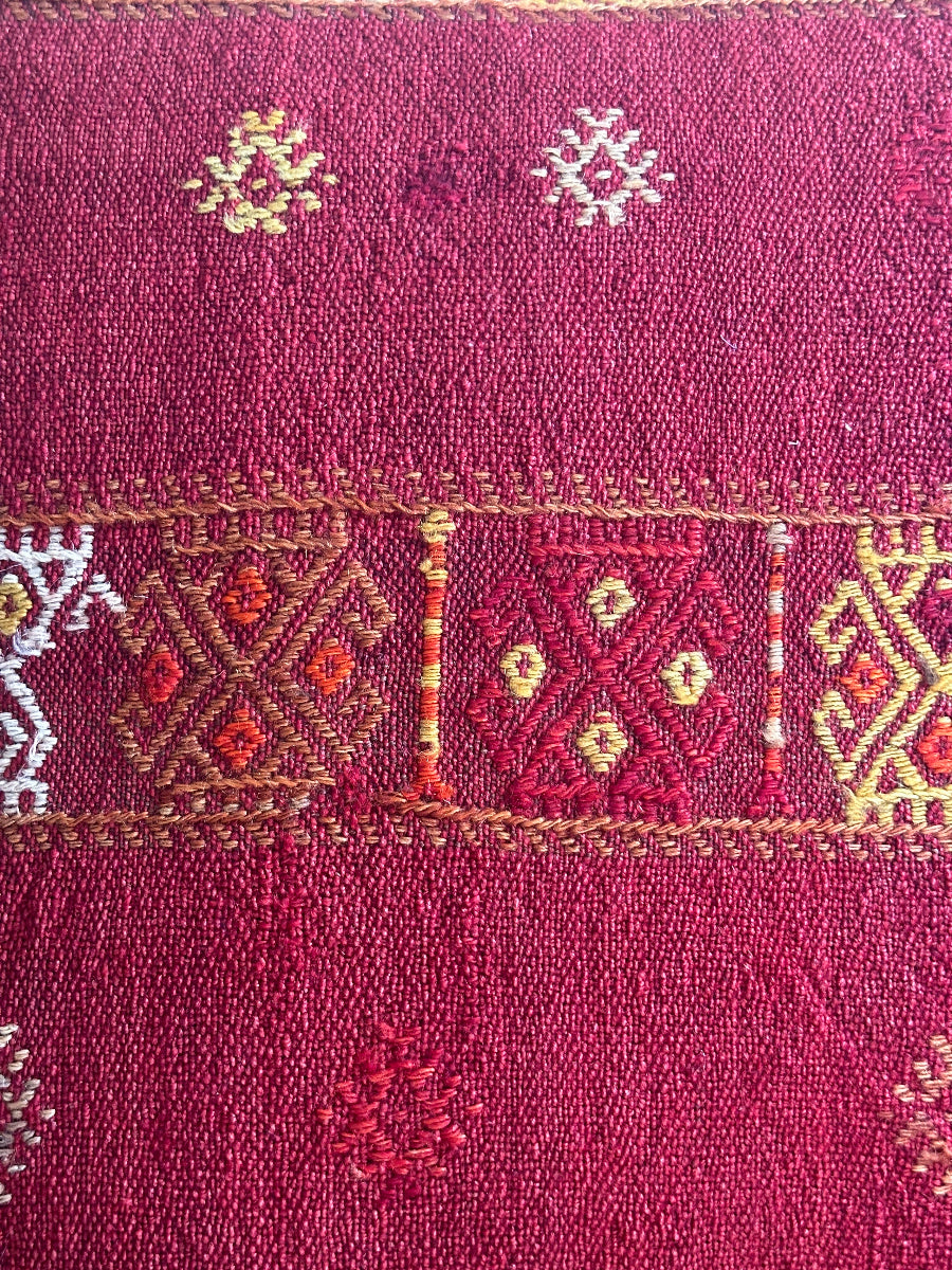 Handwoven red embroidered Turkish throw pillow, 26x26 inches, wool front with geometric design and pops of yellow and white, cotton backing—boho home decor.