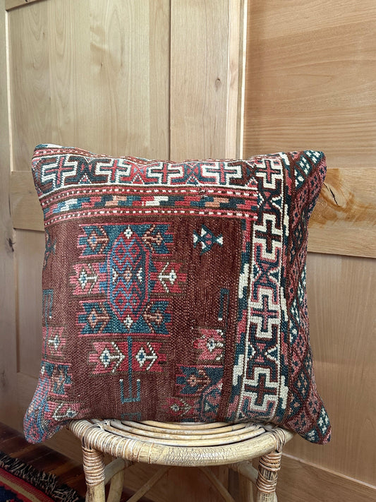 Handwoven red and green Turkish throw pillow, 20x20 inches, wool front with geometric design and pops of white, cotton backing—boho home decor.