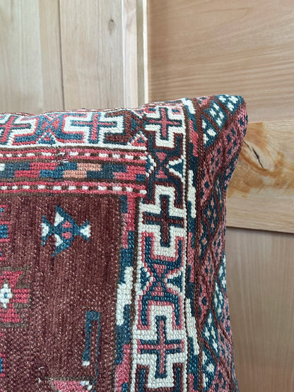 Handwoven red and green Turkish throw pillow, 20x20 inches, wool front with geometric design and pops of white, cotton backing—boho home decor.