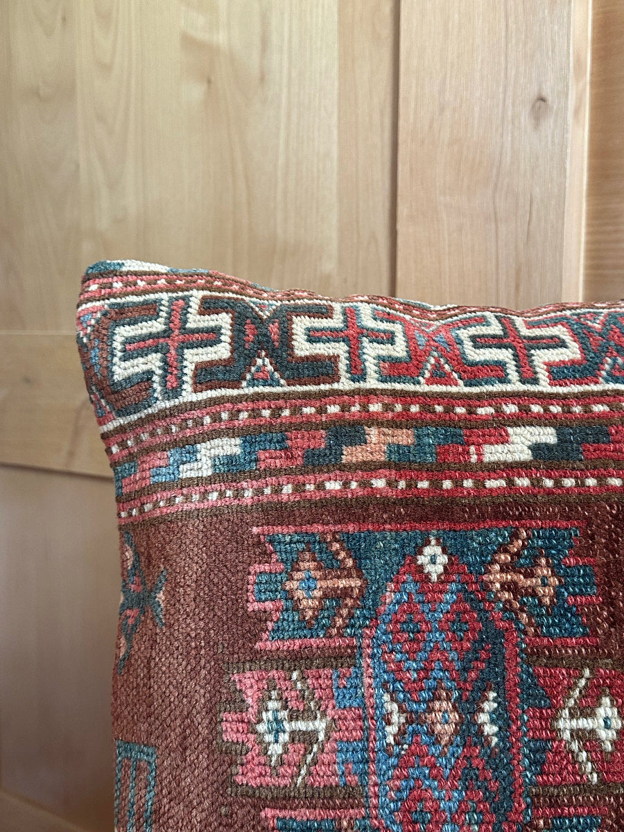 Handwoven red and green Turkish throw pillow, 20x20 inches, wool front with geometric design and pops of white, cotton backing—boho home decor.